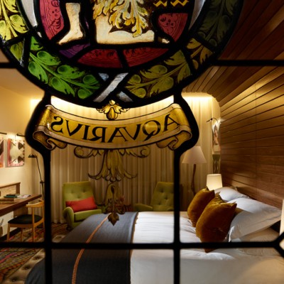 The Hospital Club hotel room with stained glass window